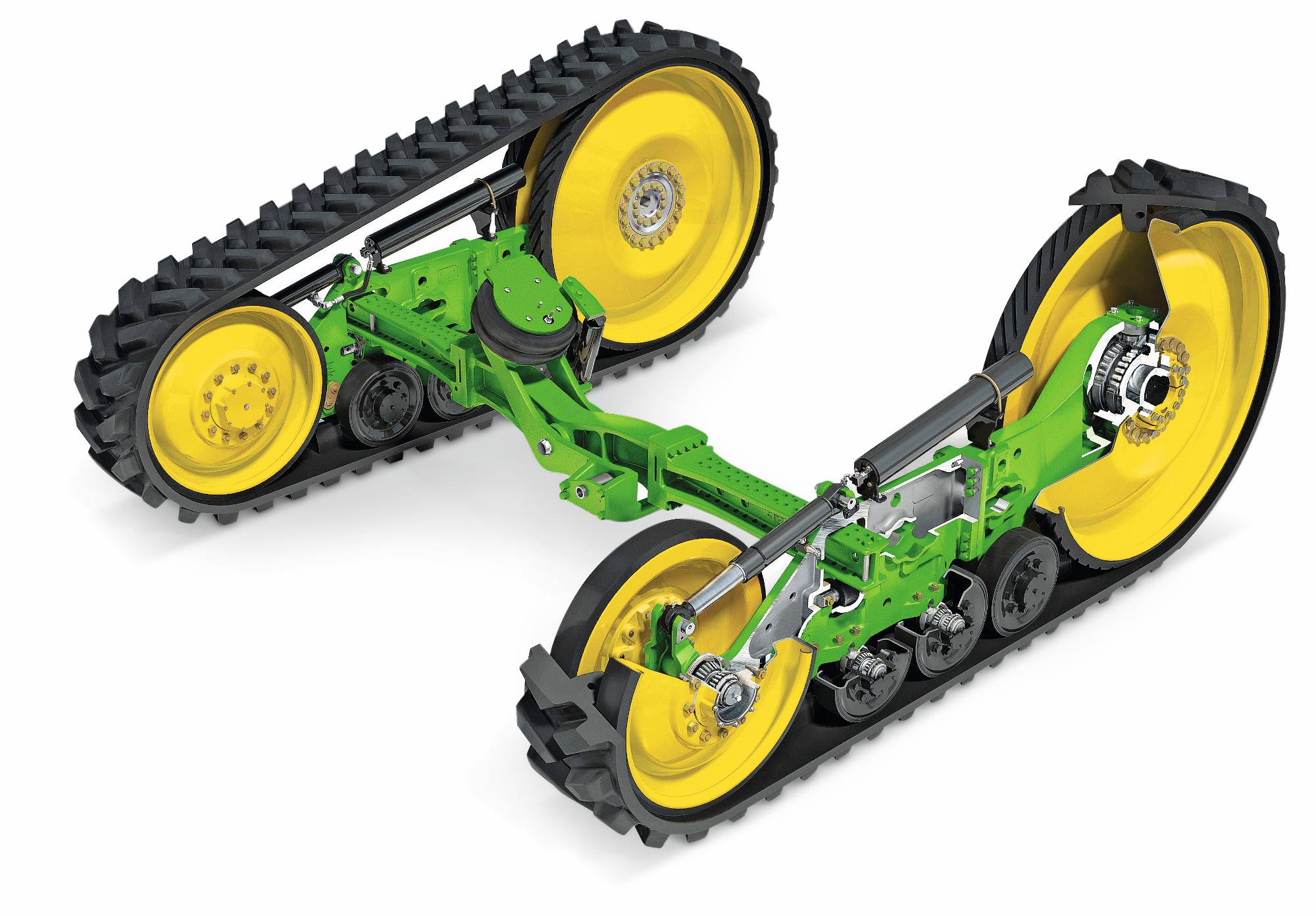 Pásové jednotky traktora John Deere s gumovými pásmi, odpruženými ramenami a žltými hnacími kolesami zobrazené na bielom štúdiovom pozadí.